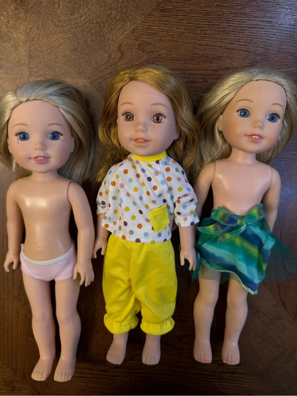 3 American girl-wellie wisher dolls.